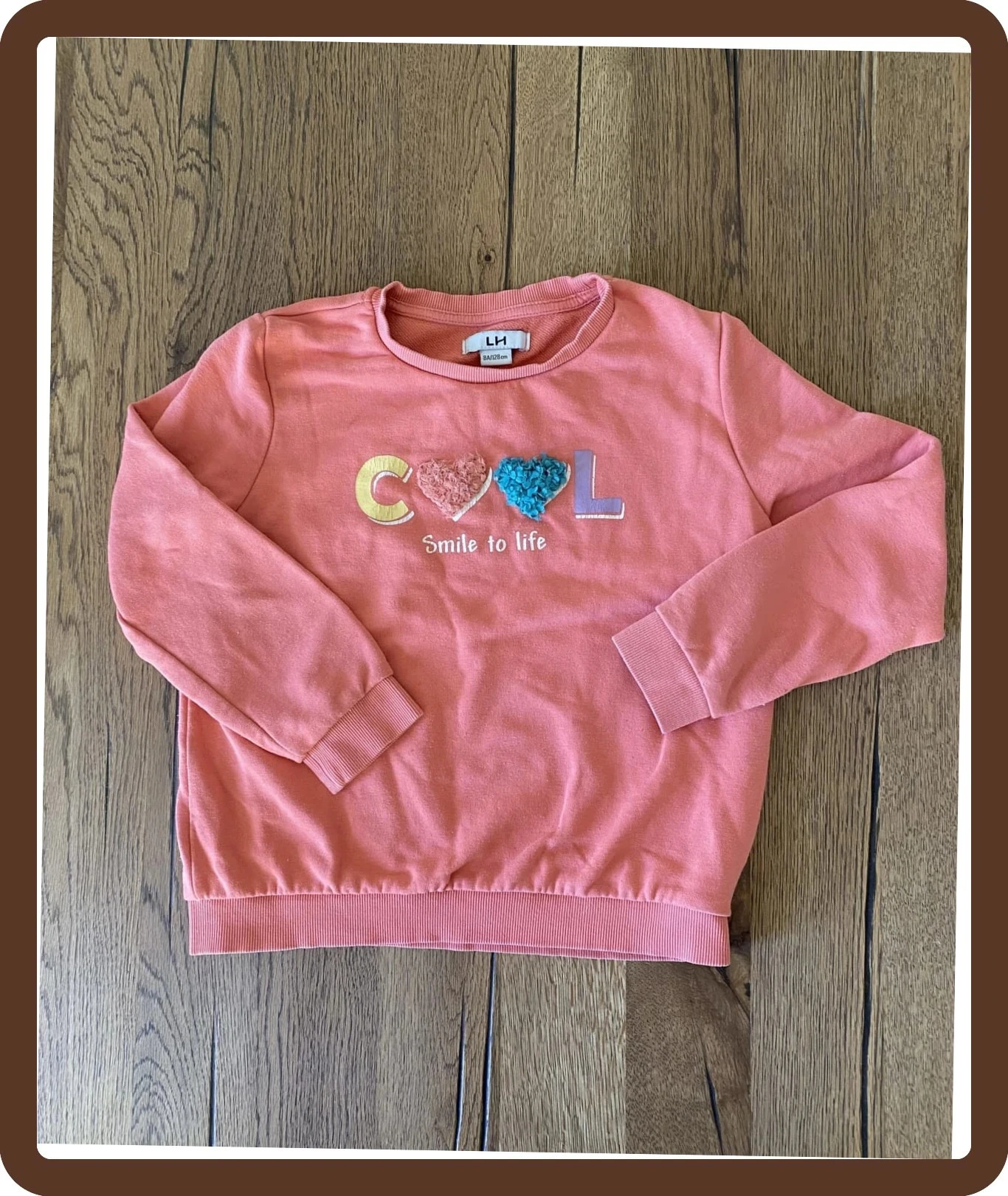 Sweat rose corail 8 ans La Halle – motif COOL, doux et confortable